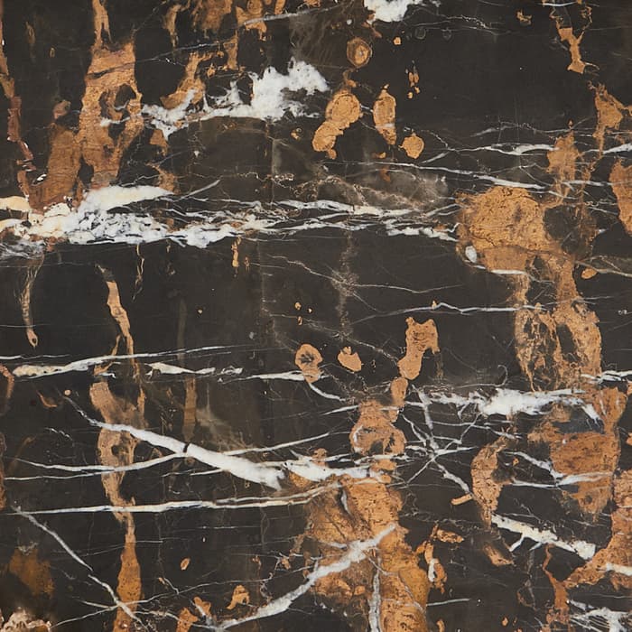 A rectangular tray with a polished, black marble center veined with white and rusty brown patterns, framed by a smooth, light wooden border, all set against a plain white backdrop.