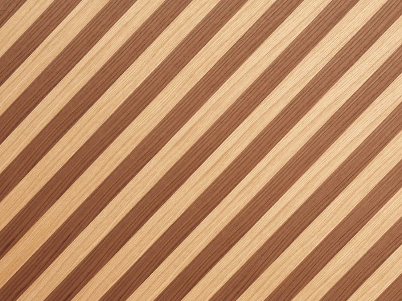 The rectangular wooden board features alternating diagonal stripes of light and dark wood, set against a plain white background. No text is present.